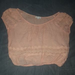 Peach colored off the shoulder crop top